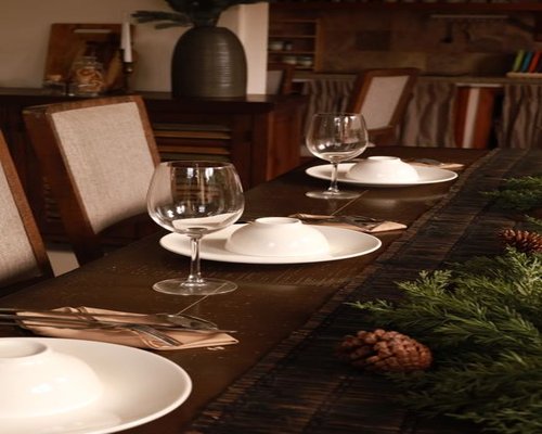 A simple, comforting family dinner setting on a wooden dining table in a Thai home